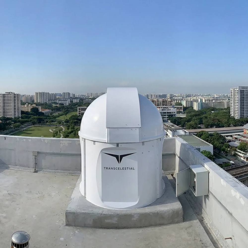 A TMOGS optical ground station installed on a rooftop in Singapore.